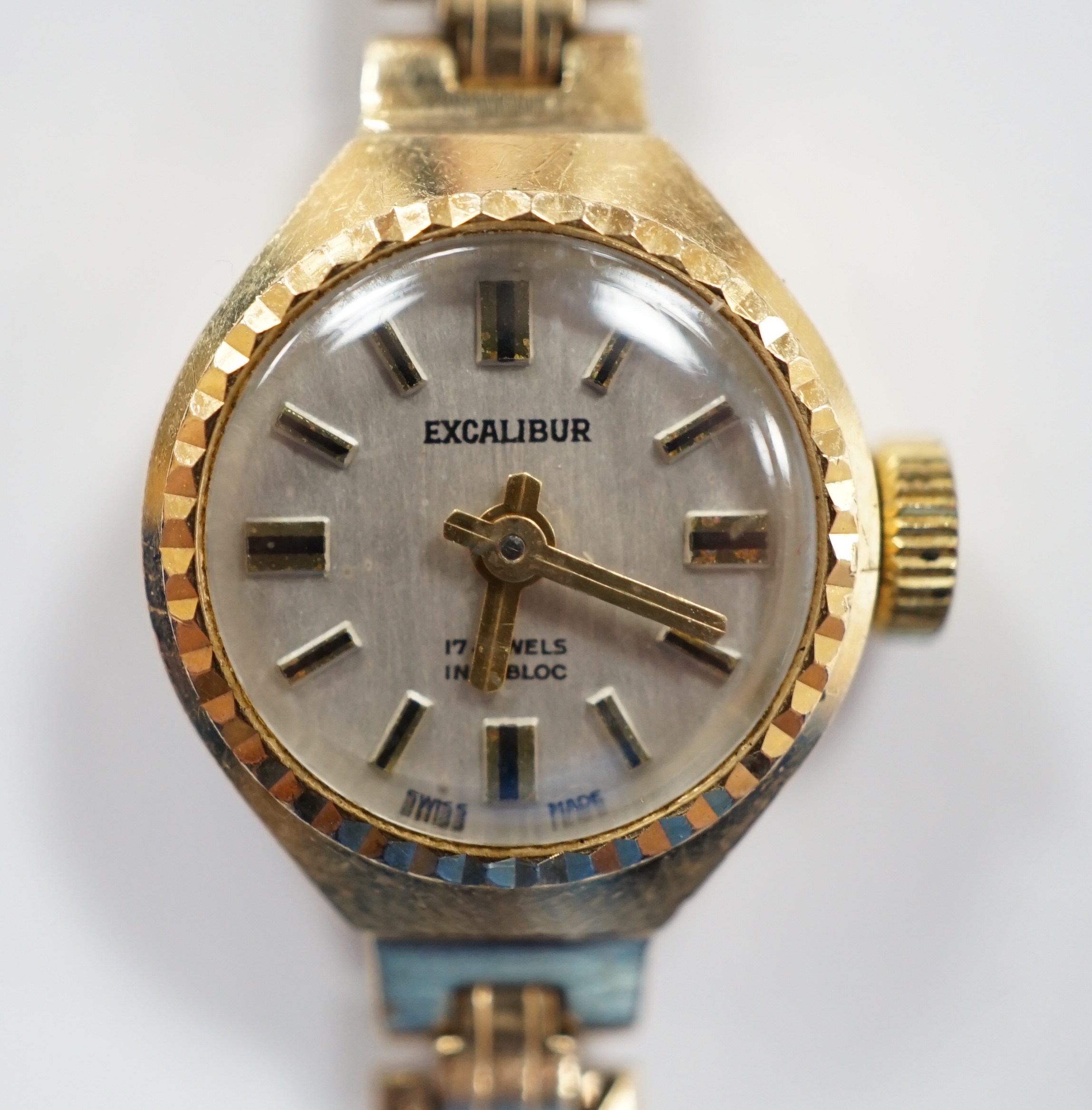 A lady's 9ct gold Excalibur manual wrist watch, on a 9ct gold bracelet, overall 17.5cm, gross weight 12 grams.